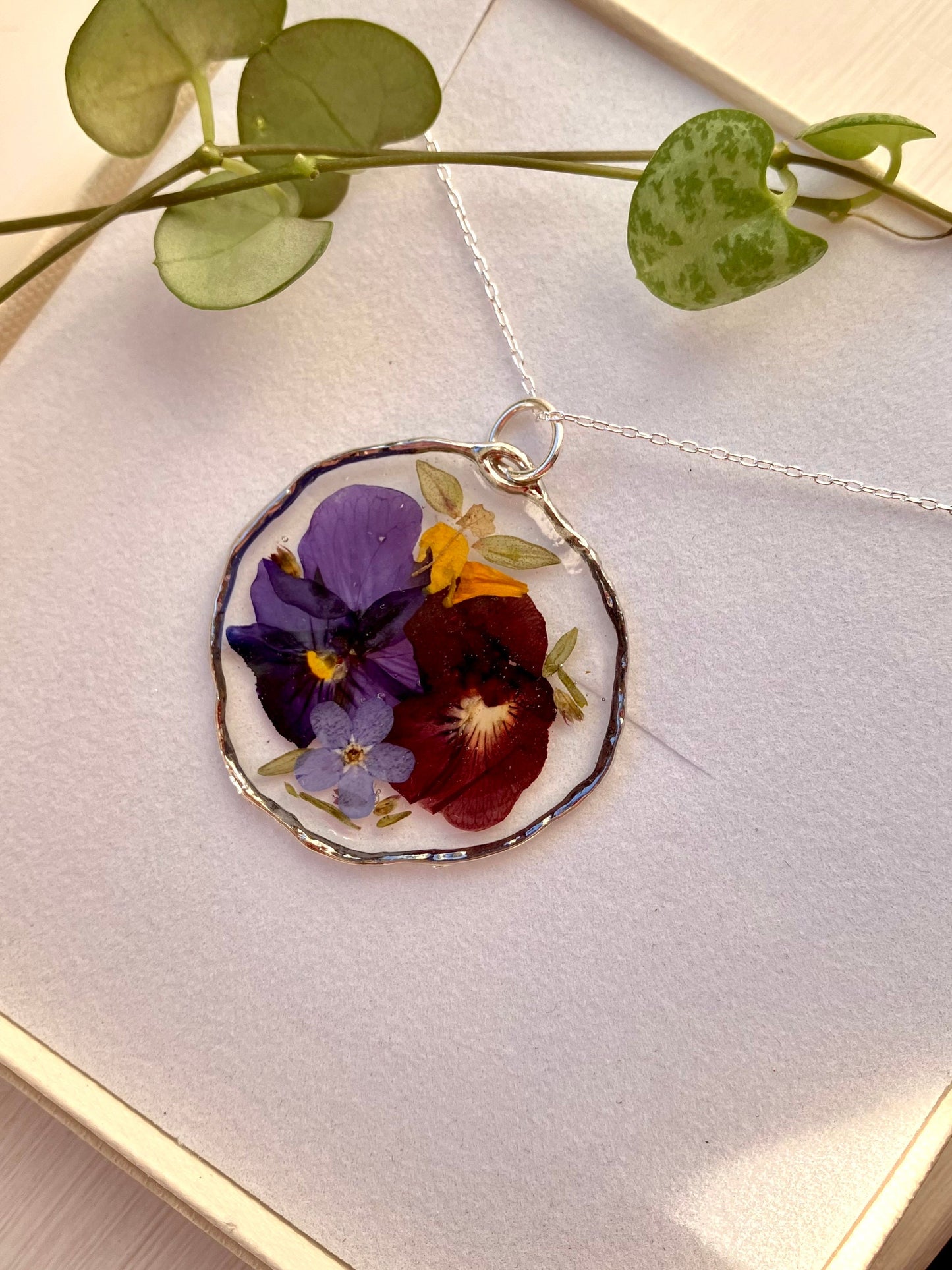 Real pressed flower necklace. Forget me nots, thyme leaves and violas , In silver with a silver chain. 31mm size - Only 1 rare item