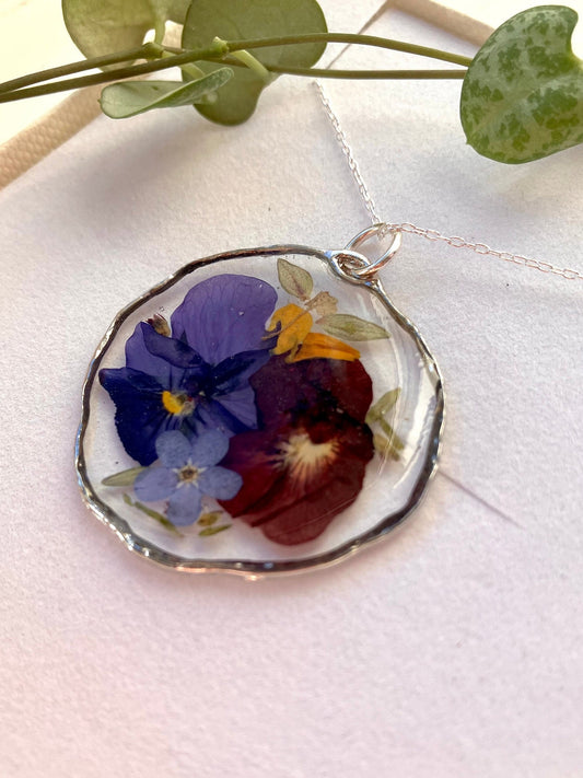 Real pressed flower necklace. Forget me nots, thyme leaves and violas , In silver with a silver chain. 31mm size - Only 1 rare item