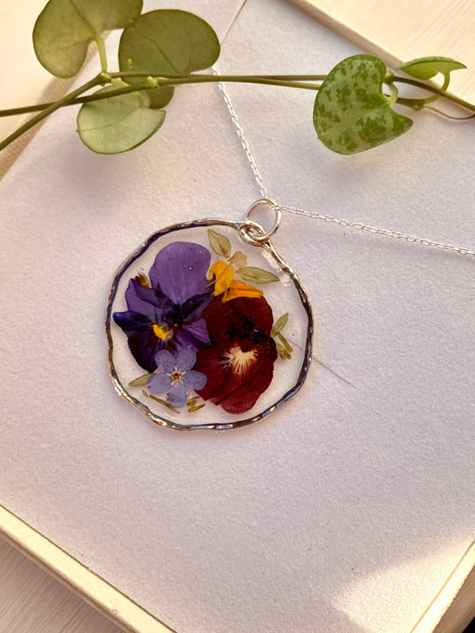 Real pressed flower necklace. Forget me nots, thyme leaves and violas , In silver with a silver chain. 31mm size - Only 1 rare item